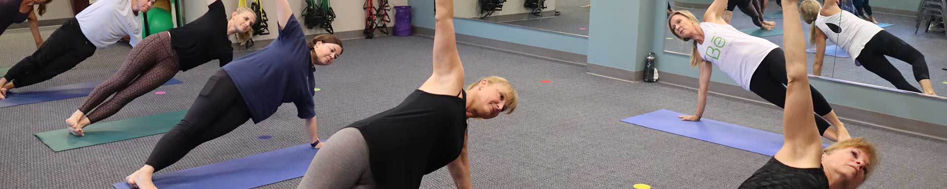 Be Health and Well-Being at St. Joseph's/Candler - Multiple women taking Yoga