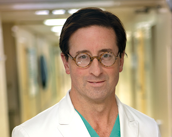 A headshot of a doctor in Howington