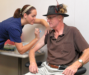 A man being administered a flu vaccine.