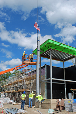 Beam1 The final steel beam is put in place at the St. Joseph's Hospital construction site during a ceremony on Thursday, Aug. 25