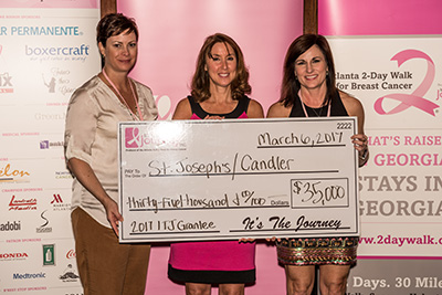 Krista Aliffi (left), LCRP Nurse Navigator, and Lora Reese (right), Telfair Pavilion Director, are pictured with an It's The Journey, Inc. representative during a check presentation for $35,000