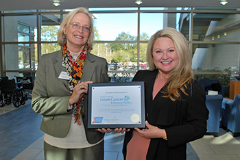 Left, Nancy Johnson, Executive Director of the Nancy N. and J.C. Lewis Cancer & Research Pavilion; right, Ashley Cashon, Health Systems Manager, Hospitals, Southeast Region, ACS.