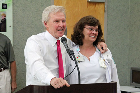 St. Joseph's/Candler President & CEO Paul P. Hinchey presents Mary Robinson with the 25th annual McAuley Award