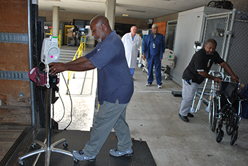 Co-workers at St. Joseph's/Candler load a truck with donated supplies for Dr. Eugene Nwosu