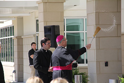 Bishop Gregory John Hartmayer blesses the building at a dedication ceremony