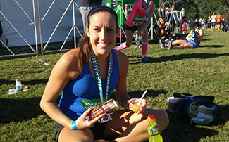 After a long race, this runner snacks on a fruit cup, protein bar and sports drink.