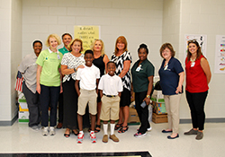 Angels of Mercy volunteers with students and staff from Andrea B. Williams Elementary School