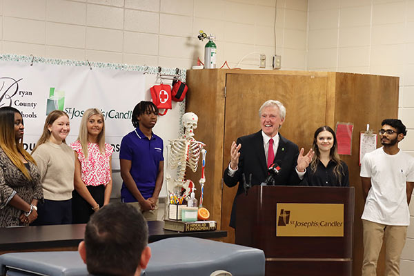 Paul P. Hinchey, President & CEO of St. Joseph’s/Candler with Richmond Hill High School students.