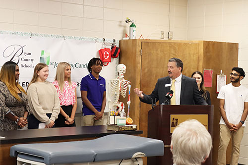 Dr. Paul T. Brooksher, Superintendent of Bryan County Schools with Richmond Hill High School students.