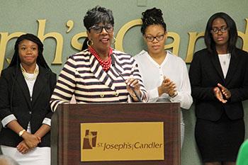 Dr. Ann Levett addresses the crowd at Thursday's announcement of a new partnership.