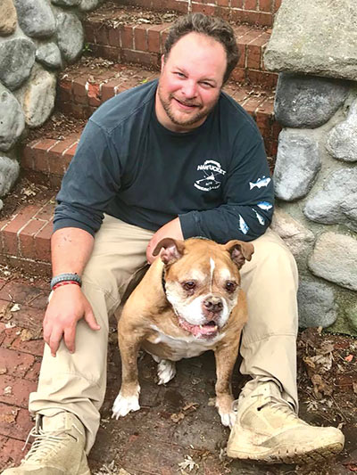 BJ Ganem with his dog, Dozer
